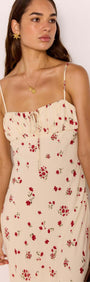 Red & Cream Floral Bias Midi Dress on model, featuring delicate spaghetti straps and floral print.