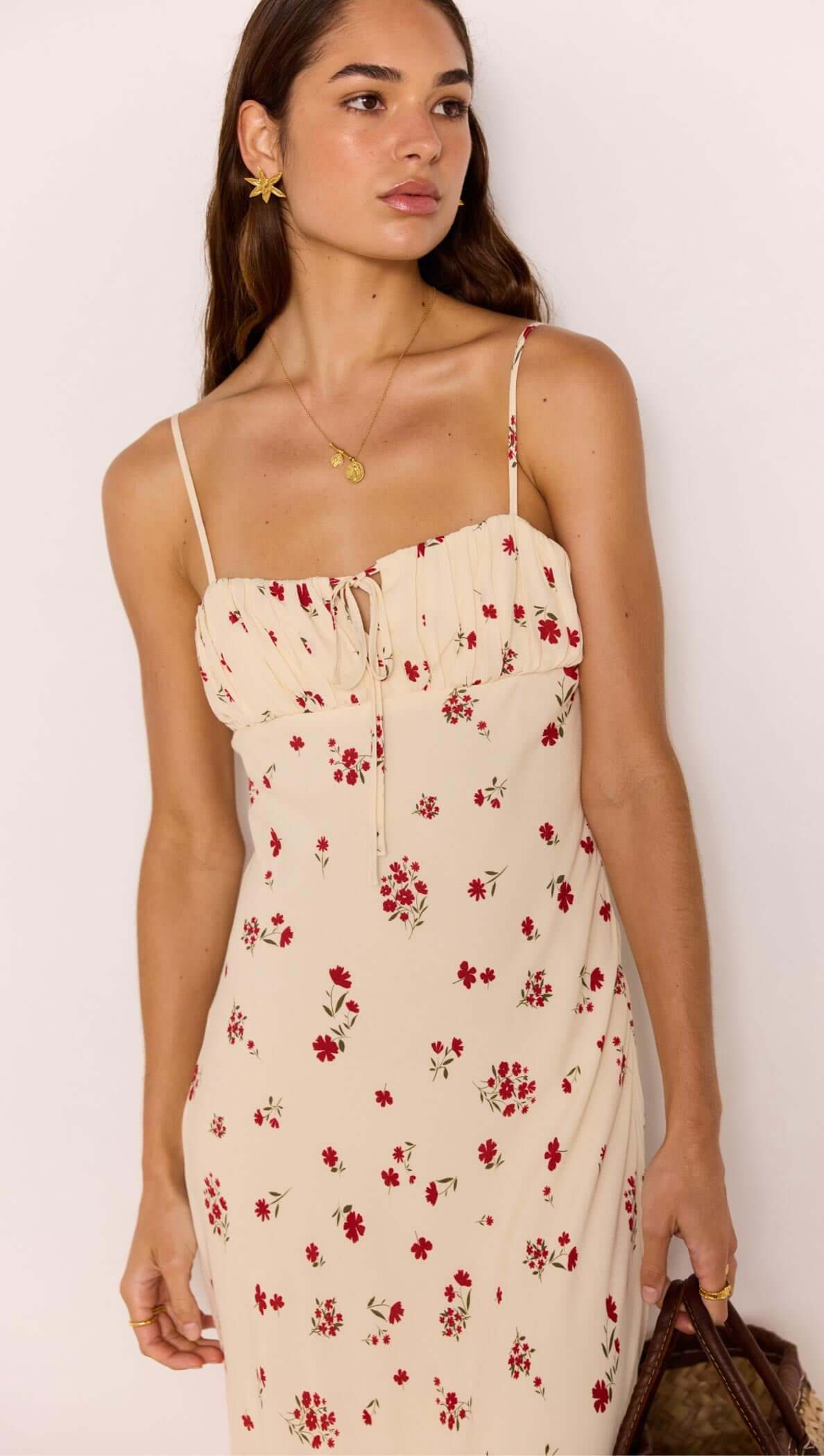 Red &amp; Cream Floral Bias Midi Dress on model, featuring delicate spaghetti straps and floral print.