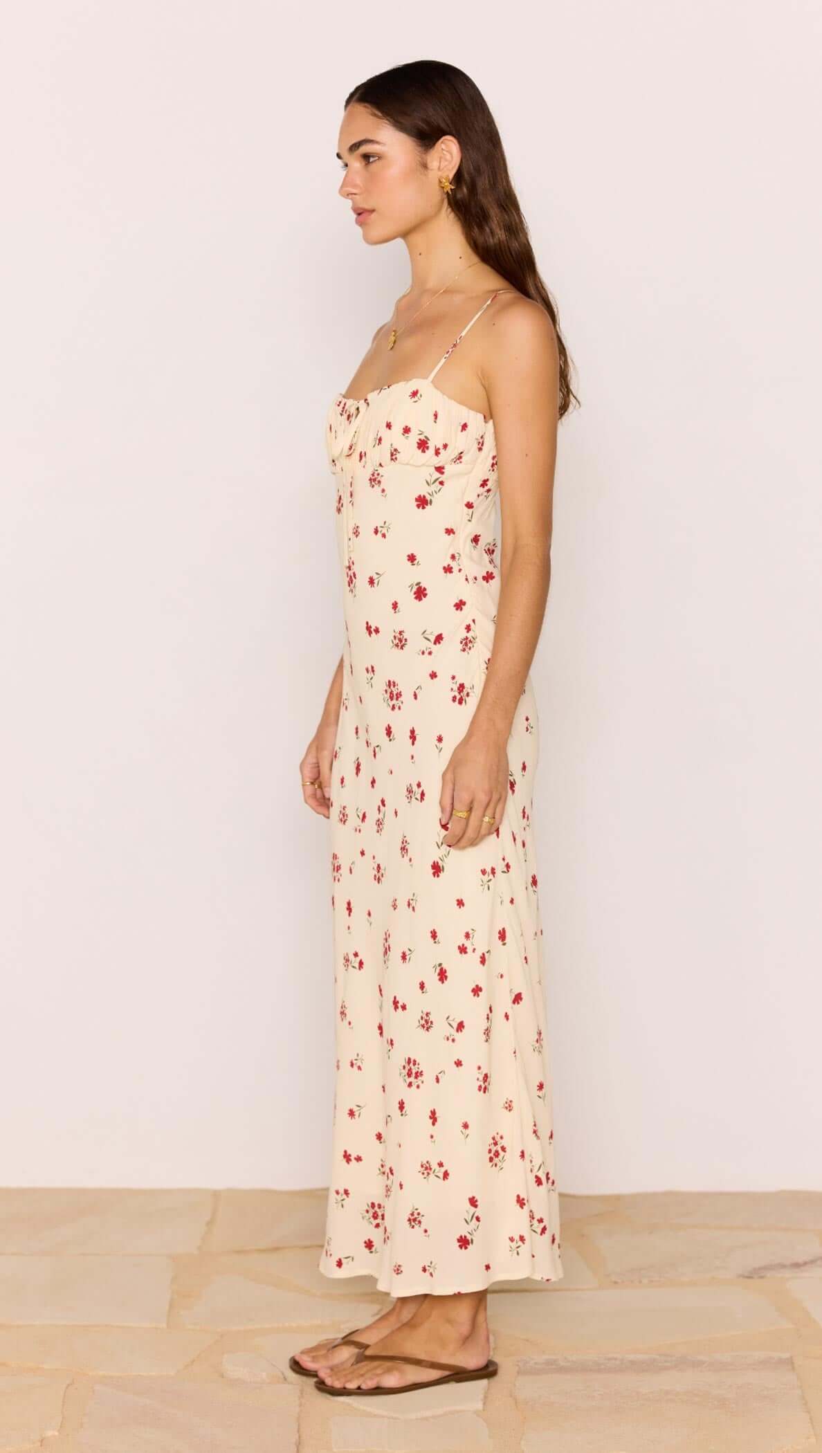 Red &amp; Cream Floral Bias Midi Dress showcased on a model, featuring spaghetti straps and floral print.