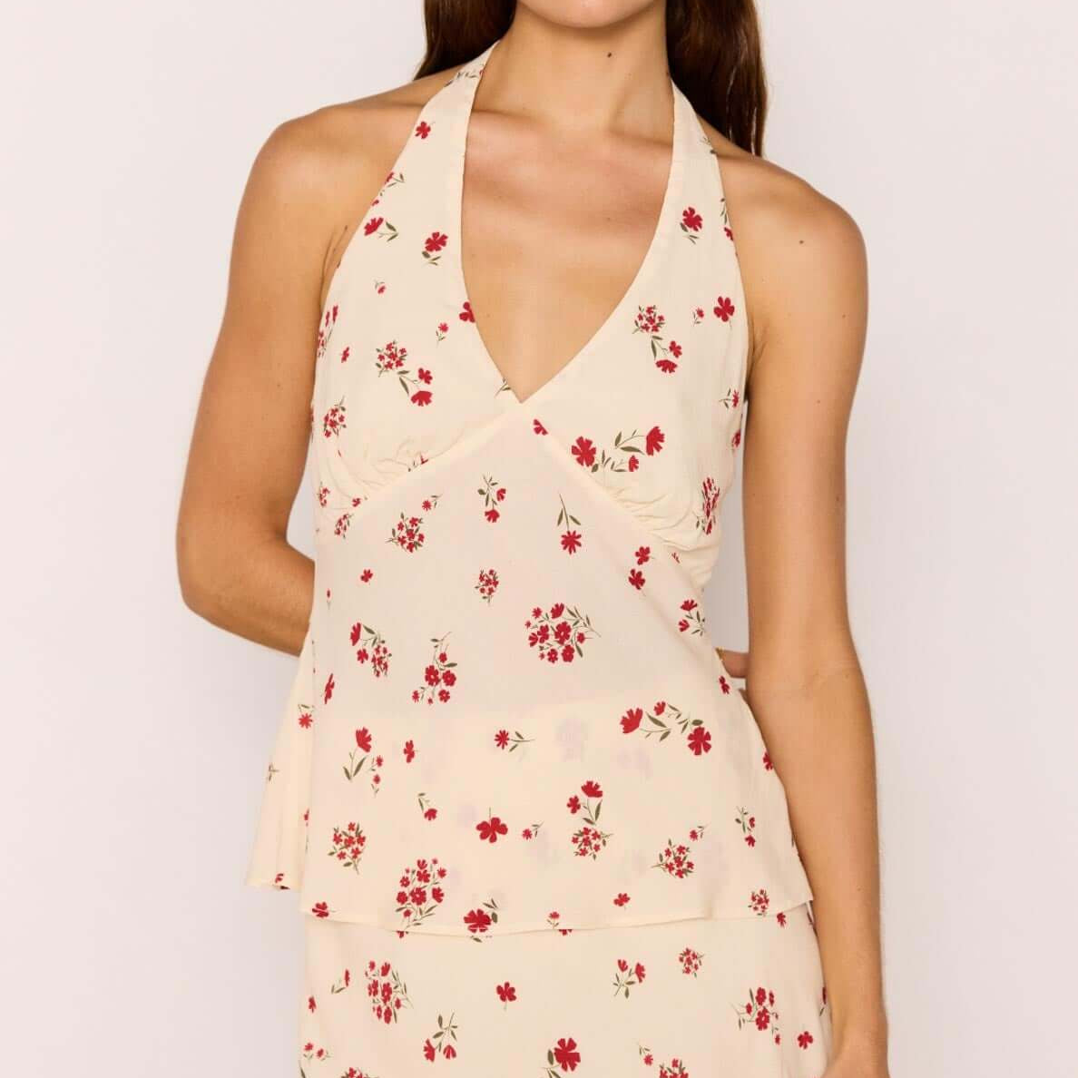 Red & Cream Floral Halter Bias Top worn by model, showcasing vintage-inspired floral print and halter neckline.