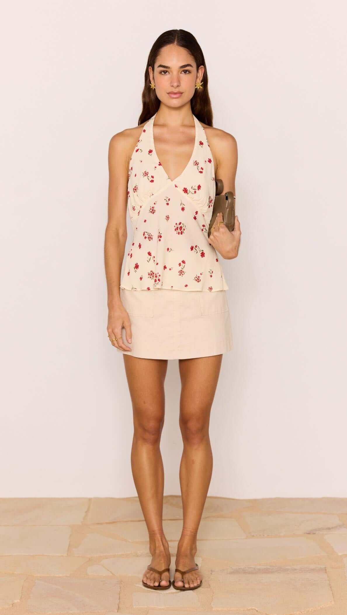 Red &amp; Cream Floral Halter Bias Top worn with a matching skirt, perfect for warm-weather styling.