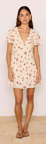 Model wearing a Red & Cream Floral Mini Dress with flutter sleeves and a V-neckline.