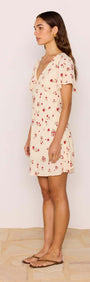 Red & Cream Floral Mini Dress shown on model, highlighting flutter sleeves and V-neckline, perfect for casual summer outings.