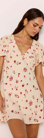 Red & Cream Floral Mini Dress displayed on a model with flutter sleeves and a flattering V-neckline.