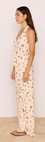 Model wearing Red & Cream Floral Ruffle Bias Maxi Skirt paired with a floral top, showcasing summer fashion.
