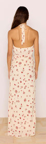 Model showcasing the back of the Red & Cream Floral Ruffle Bias Maxi Skirt on a light background.