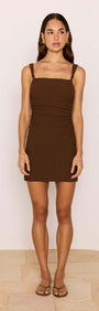 Brown Ruched Mini Dress with Bead Detail worn by a model, showcasing a chic square neckline and flattering fit.