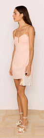 Dusty Pink Linen Mini Dress With Bead Detail worn by a model, showcasing its A-line silhouette and delicate straps.