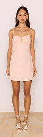 Dusty Pink Linen Mini Dress With Bead Detail worn by a model, showcasing its ruched bust and A-line silhouette.