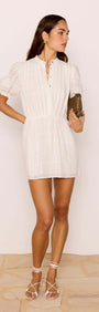 Lace Detail White Cotton Mini Dress modeled by a woman in a stylish pose, featuring puff sleeves and button-through front.