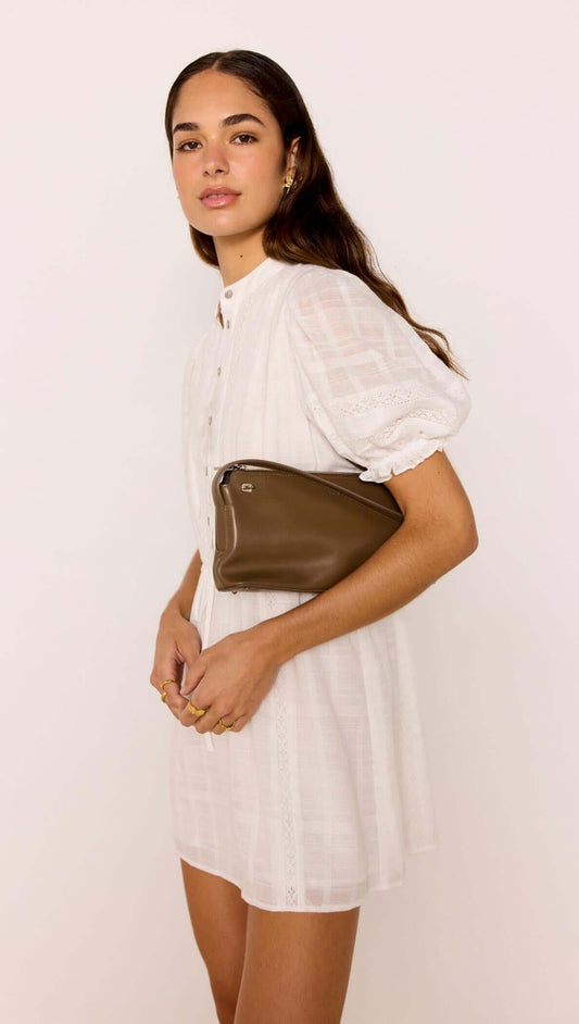 Model wearing a Lace Detail White Cotton Mini Dress, showcasing puff sleeves and a button-through front.