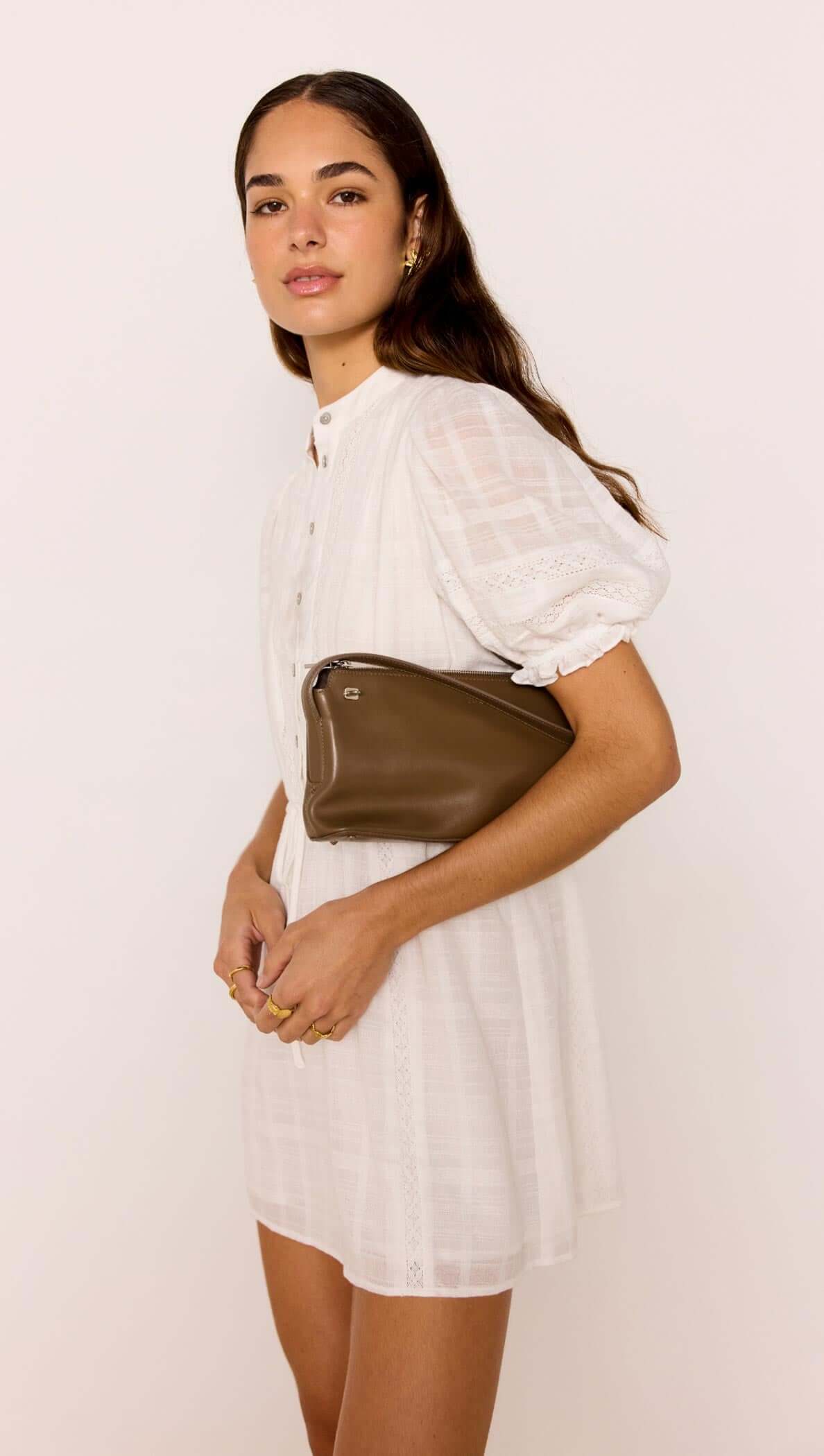 Model wearing a Lace Detail White Cotton Mini Dress, showcasing puff sleeves and a button-through front.