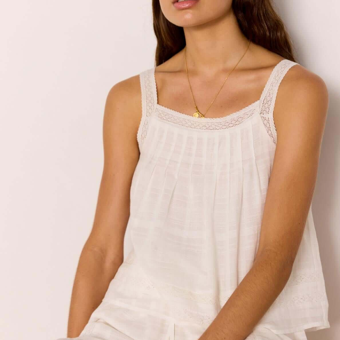 Lace Detail White Cotton Top model wearing a relaxed fit summer top with lace trim and soft viscose lining.