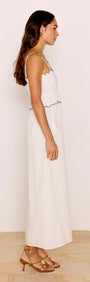 Scallop Edge Cotton White Midi Dress showcased on a model, featuring a scalloped neckline and flowing silhouette.