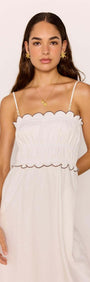 Scallop Edge Cotton White Midi Dress worn by a model, featuring a scalloped neckline and flowy silhouette.