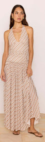 Brown & Cream Stripe Low-Waist Halter Maxi Dress worn by model, showcasing its flowing design and plunging neckline.