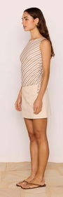 Side view of a model wearing a Brown & Cream Stripe Mesh Top paired with a beige skirt.