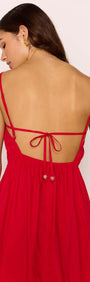 Back view of the Red Cotton Linen Blend Tie-Back Maxi Dress showcasing tie-back detail and flowing skirt.