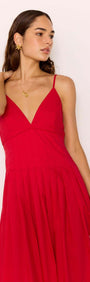 Model wearing a Red Cotton Linen Blend V-Neck Midi Dress, showcasing the elegant plunging neckline and flowing skirt.