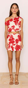 Red & White Floral Linen Blend Asymmetric Crop Top paired with mini skirt featuring bold red floral print.