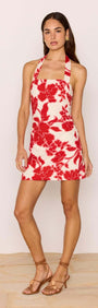 Red & White Floral Linen Blend Halter-Neck Mini Dress worn by model, showcasing bold floral print and elegant summer style.